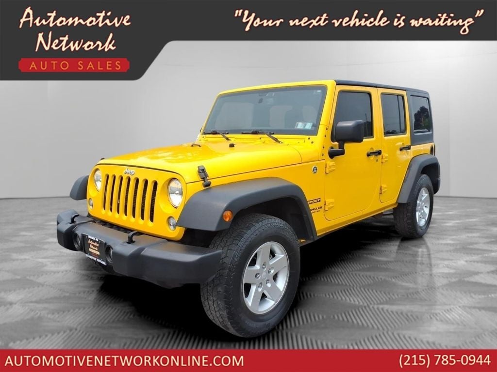 2015 Jeep Wrangler Unlimited Sport in Baja Yellow Clearcoat — front three-quarter view