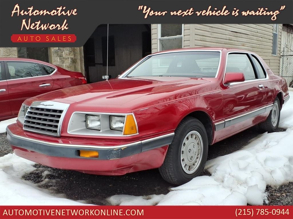 1986 Ford Thunderbird Base in Red — front three-quarter view