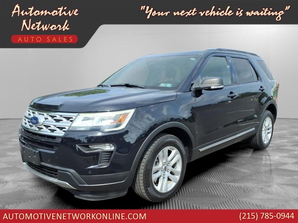 2019 Ford Explorer XLT in Black Metallic — front three-quarter view