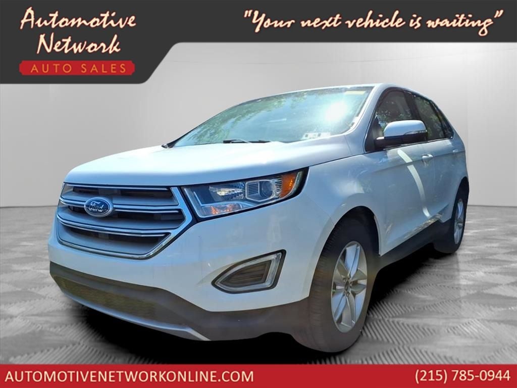 2016 Ford Edge SEL in Oxford White — front three-quarter view