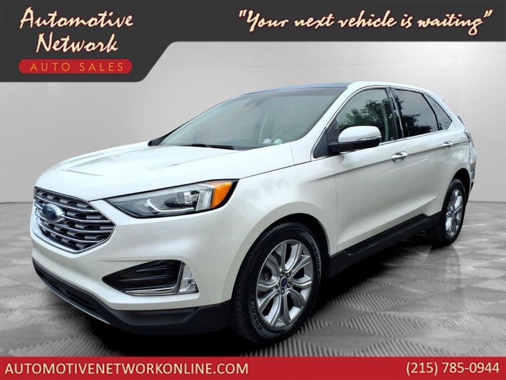 2019 Ford Edge Titanium in White Platinum Clearcoat Metallic — front three-quarter view
