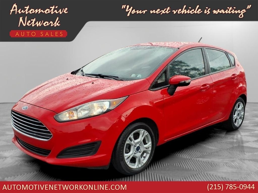 2014 Ford Fiesta SE in Race Red — front three-quarter view
