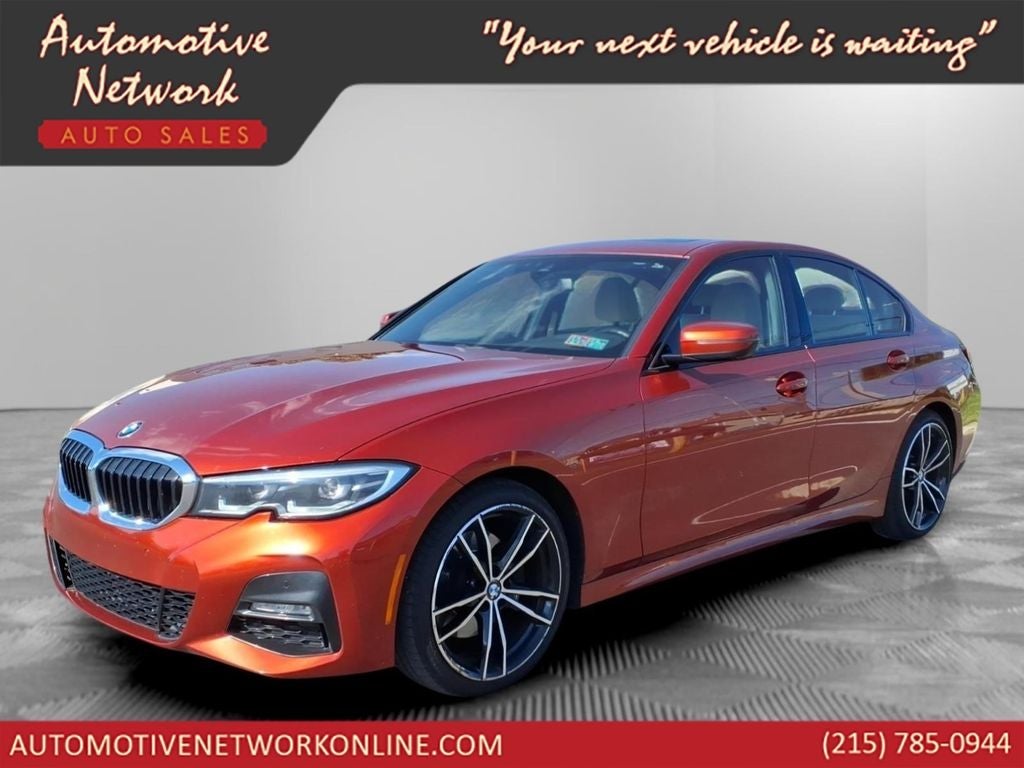 2021 BMW 3 Series 330i xDrive in Sunset Orange Metallic — front three-quarter view