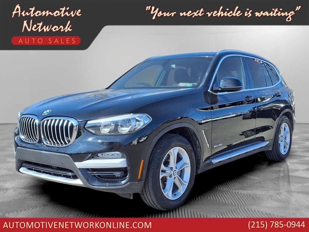 2018 BMW X3 xDrive30i in Jet Black — front three-quarter view