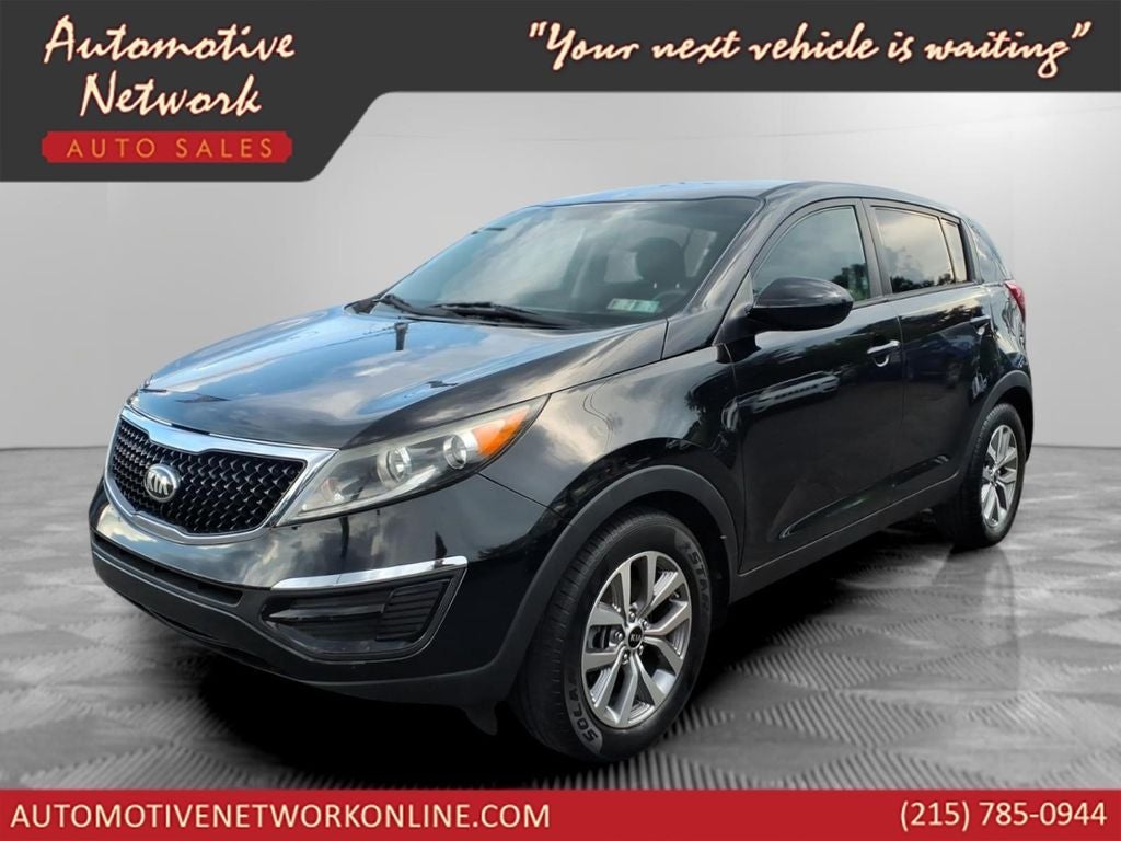 2016 Kia Sportage LX in Black Cherry — front three-quarter view